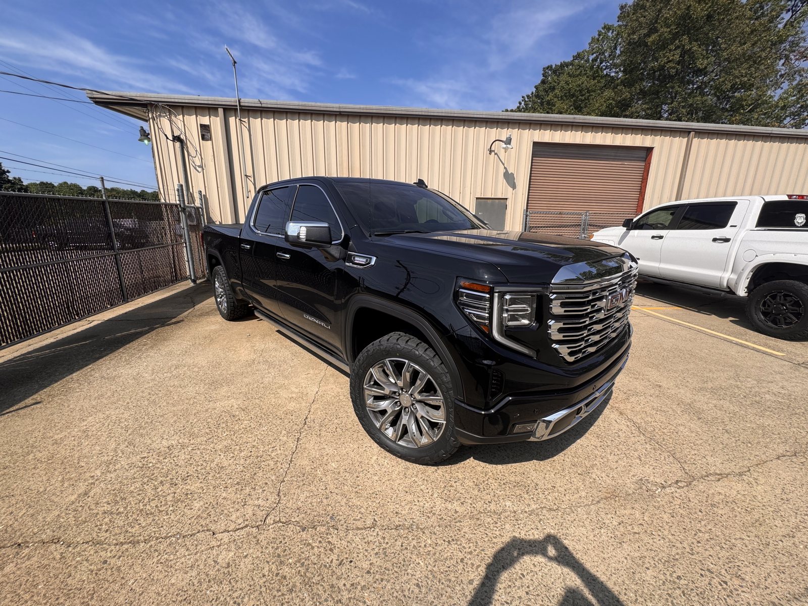 Black GMC Sierra Denali outside The Tint Guy