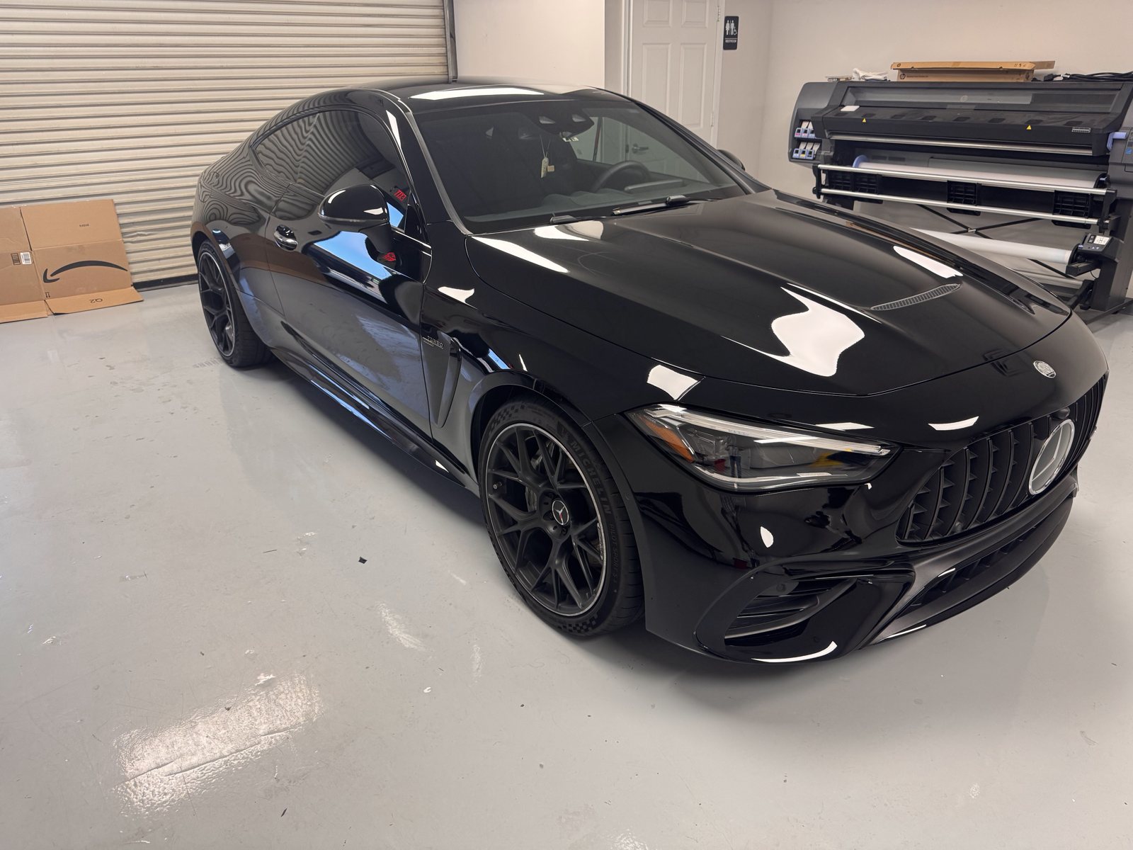 Black Mercedes-AMG inside The Tint Guy shop
