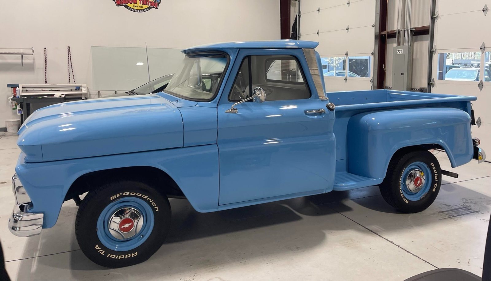 Blue classic Chevy C10 pickup inside The Tint Guy shop