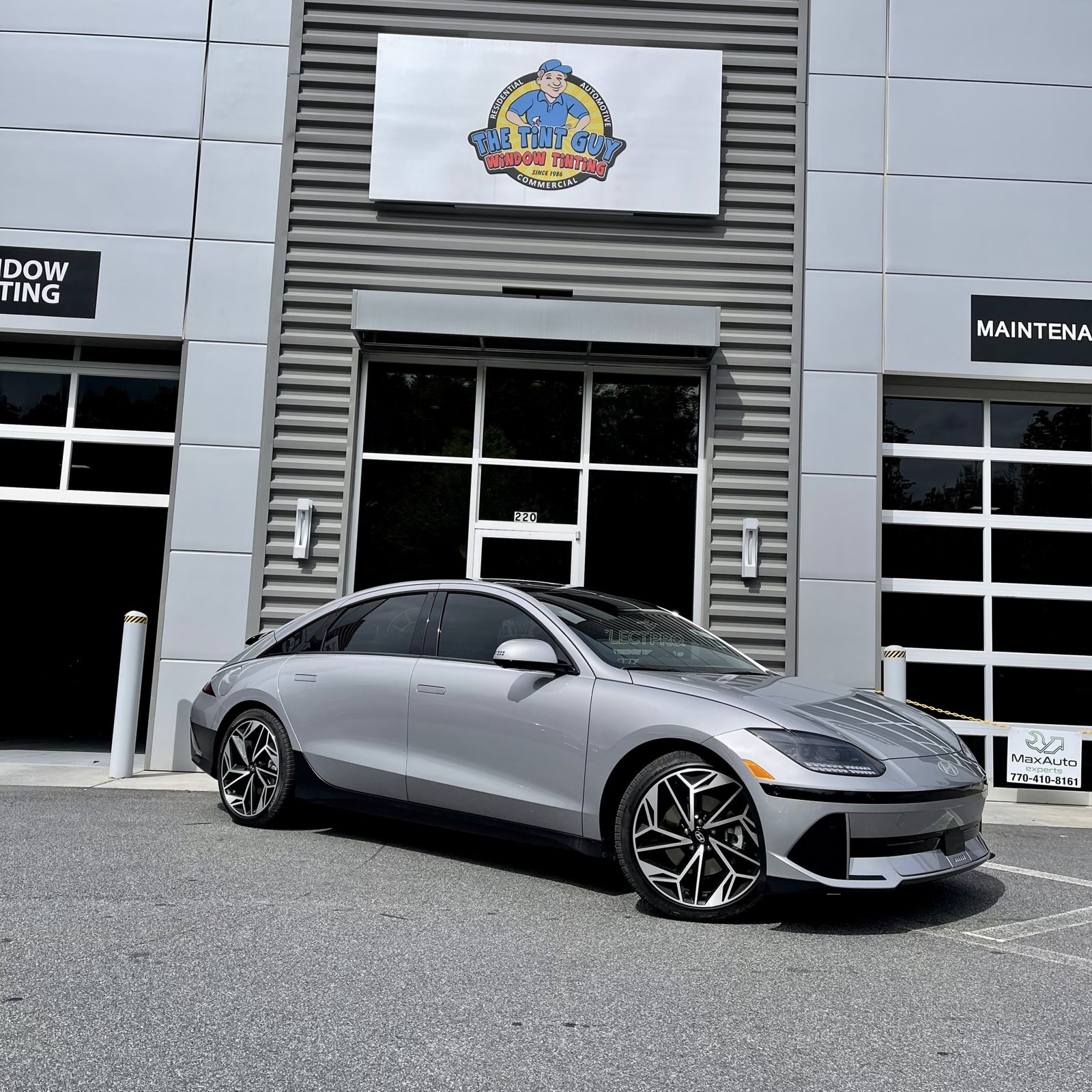 Gray sedan parked outside The Tint Guy Kennesaw shop