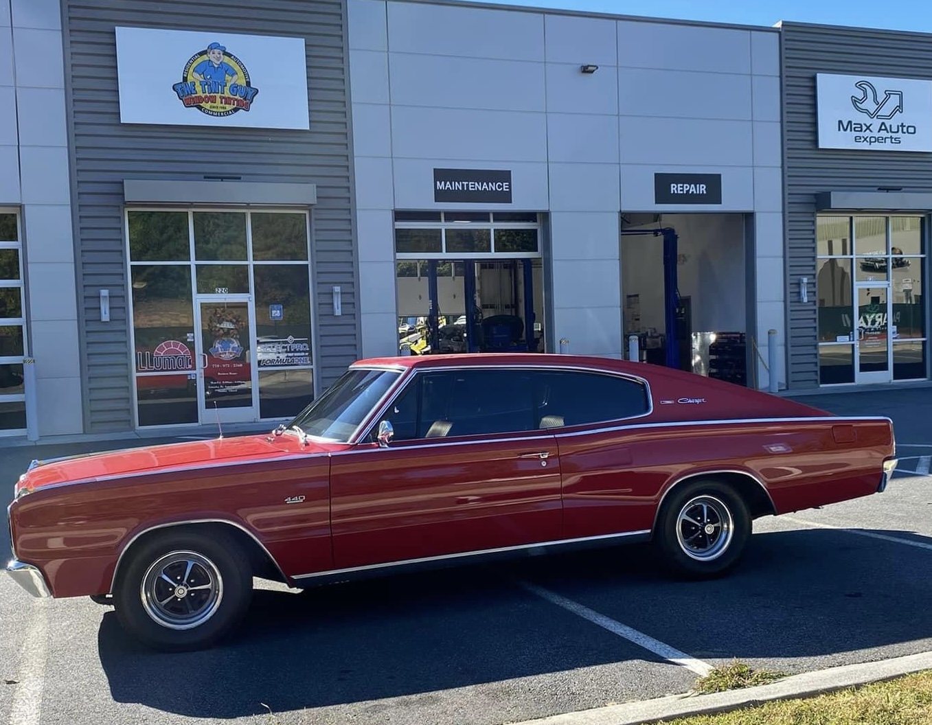 Red classic Dodge Charger outside The Tint Guy Kennesaw shop
