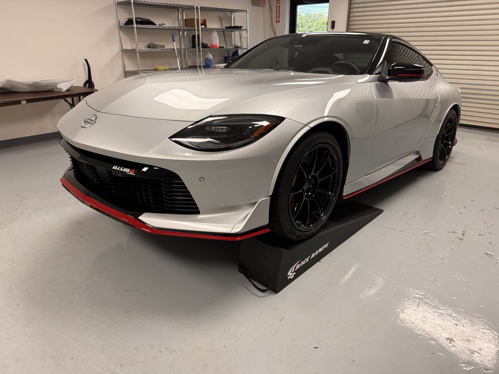 Silver Nissan Z NISMO inside The Tint Guy shop