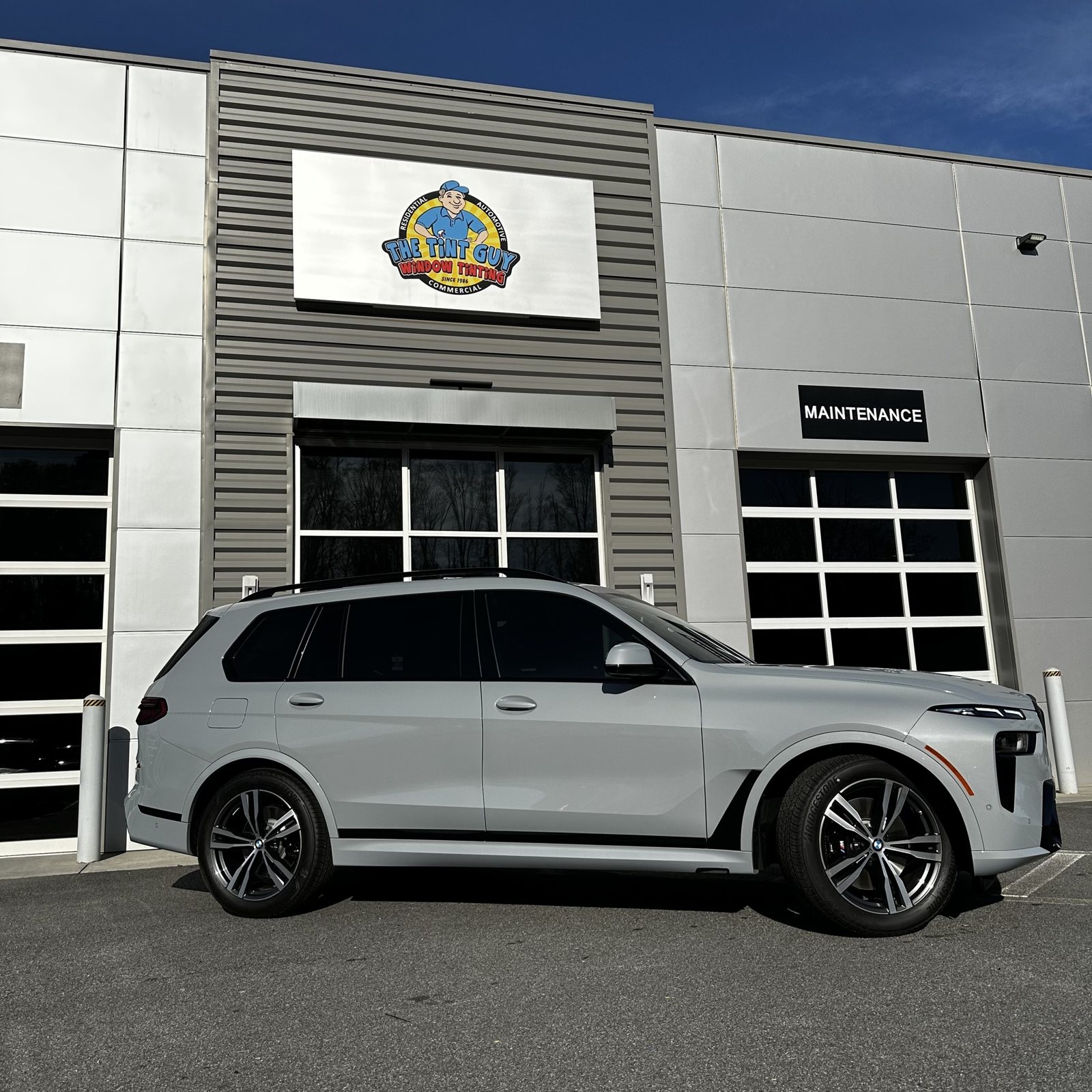 White BMW X7 outside The Tint Guy Kennesaw shop