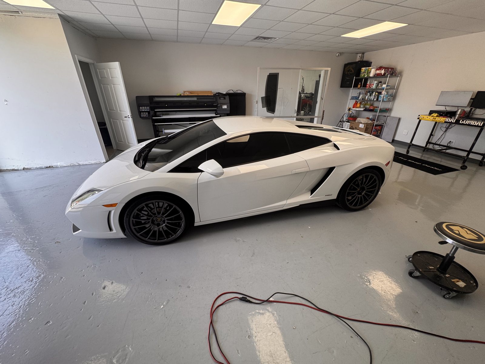 White Lamborghini in The Tint Guy install bay