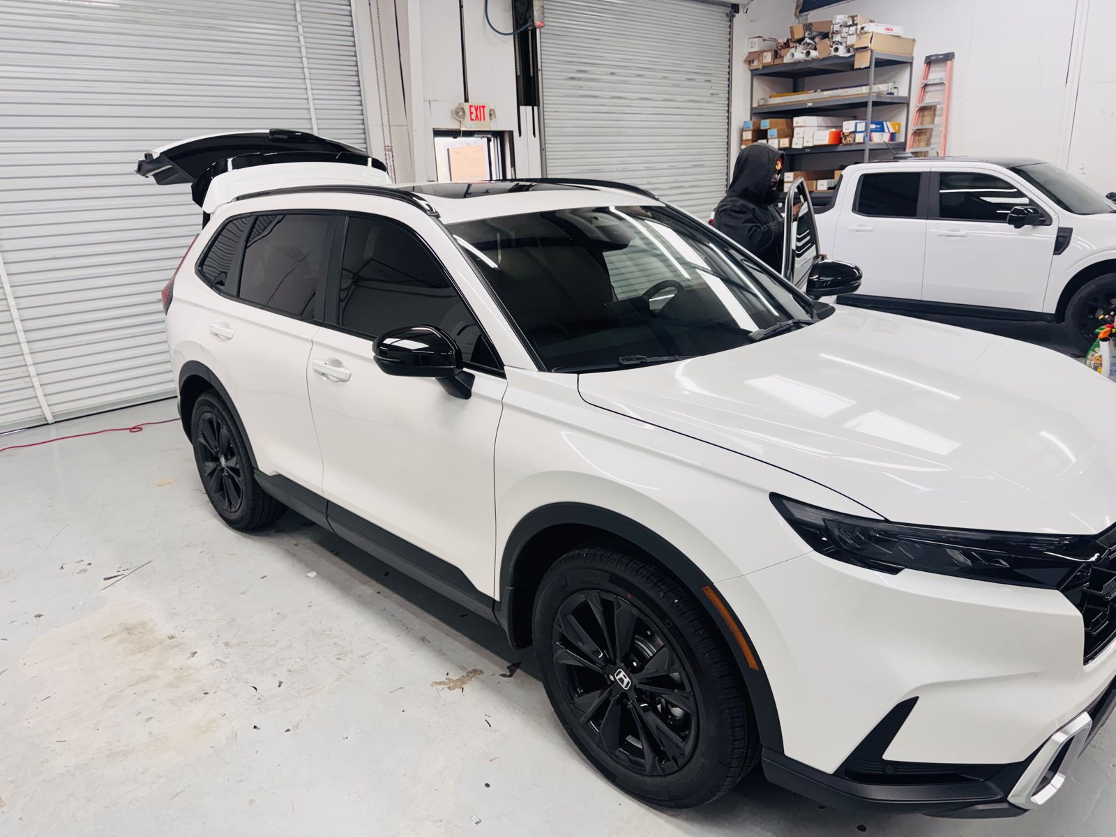 White SUV inside The Tint Guy shop